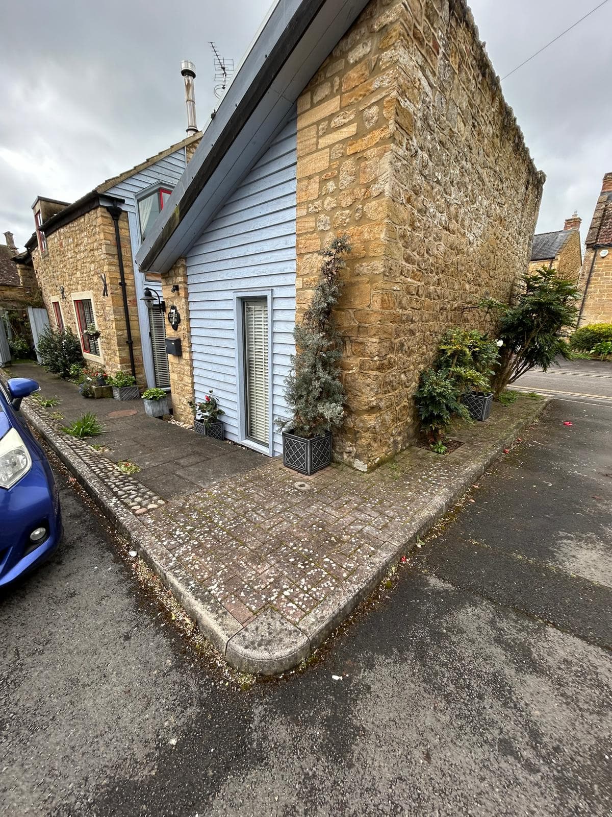 Driveway before pressure washing